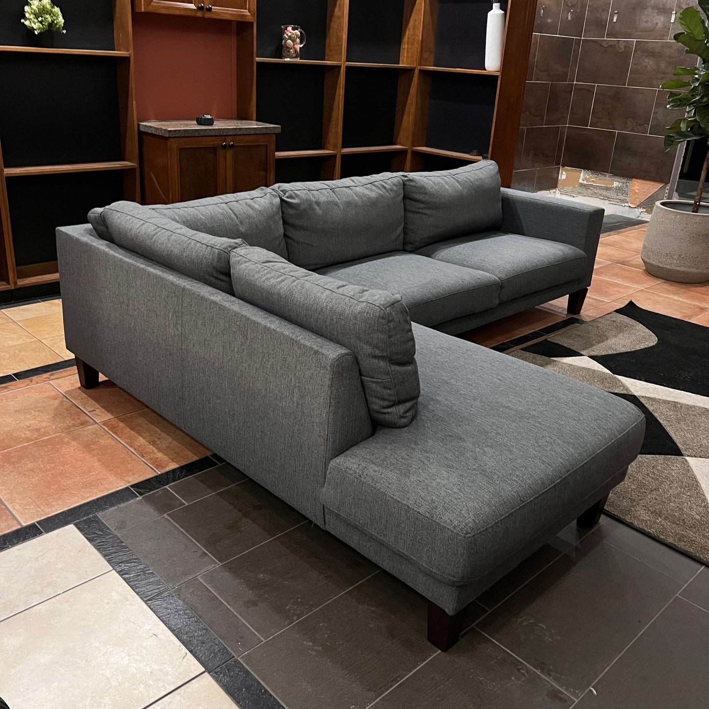 Gray modern sofa with woden legs