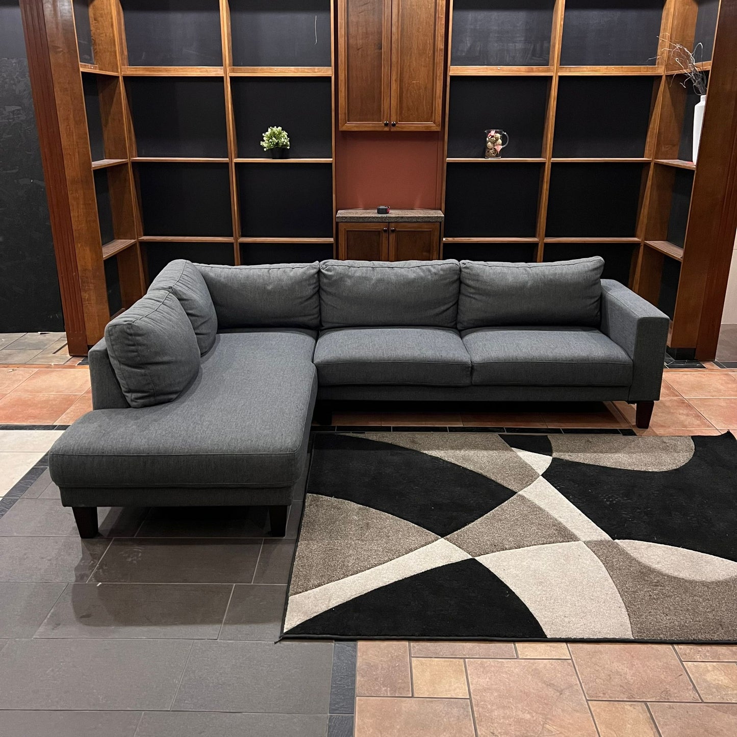 Gray modern sofa with woden legs