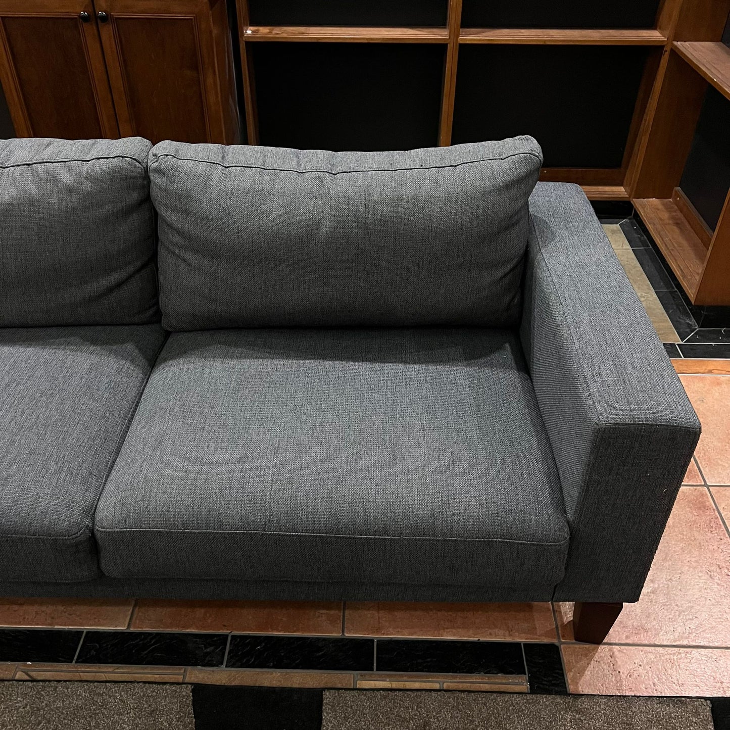 Gray modern sofa with woden legs