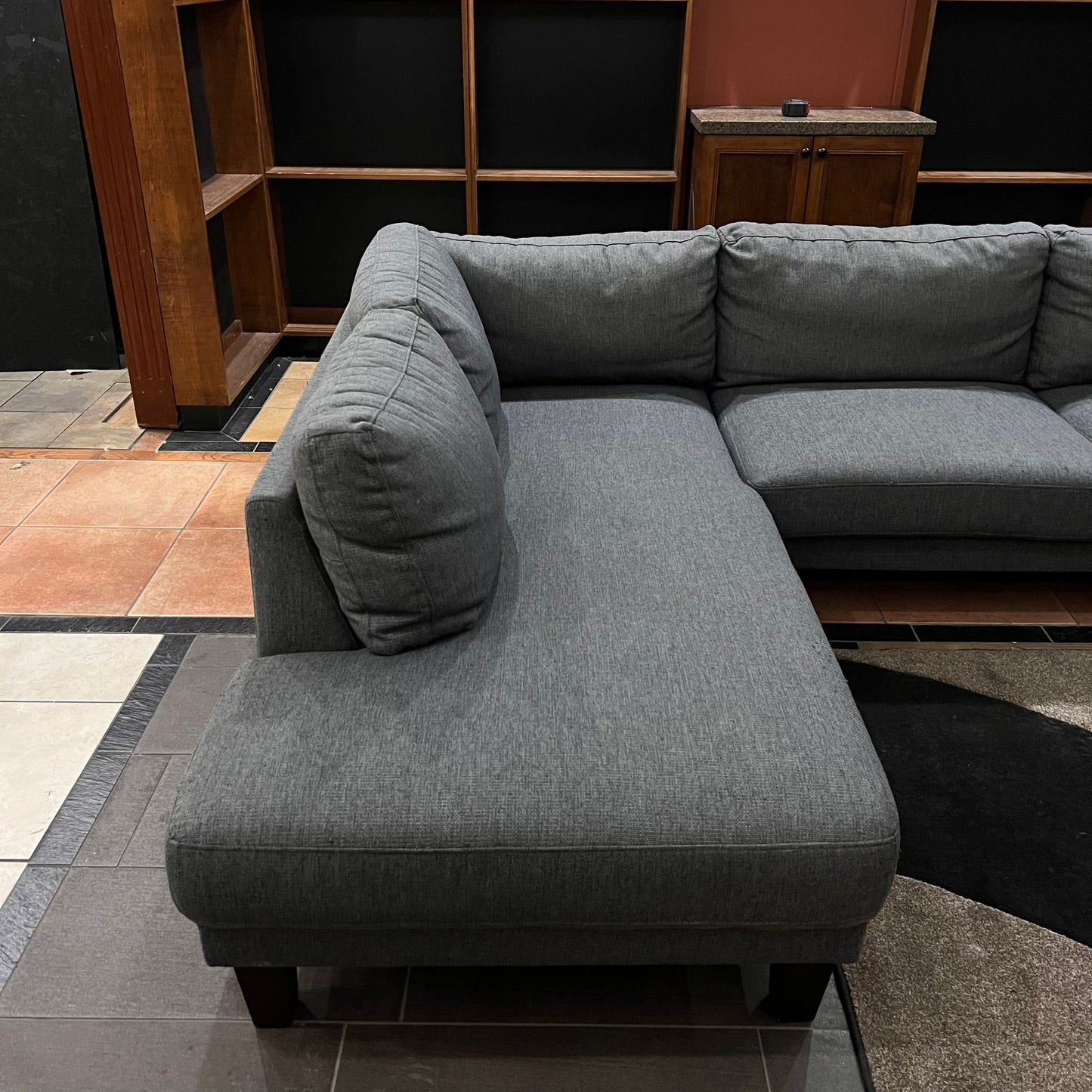 Gray modern sofa with woden legs