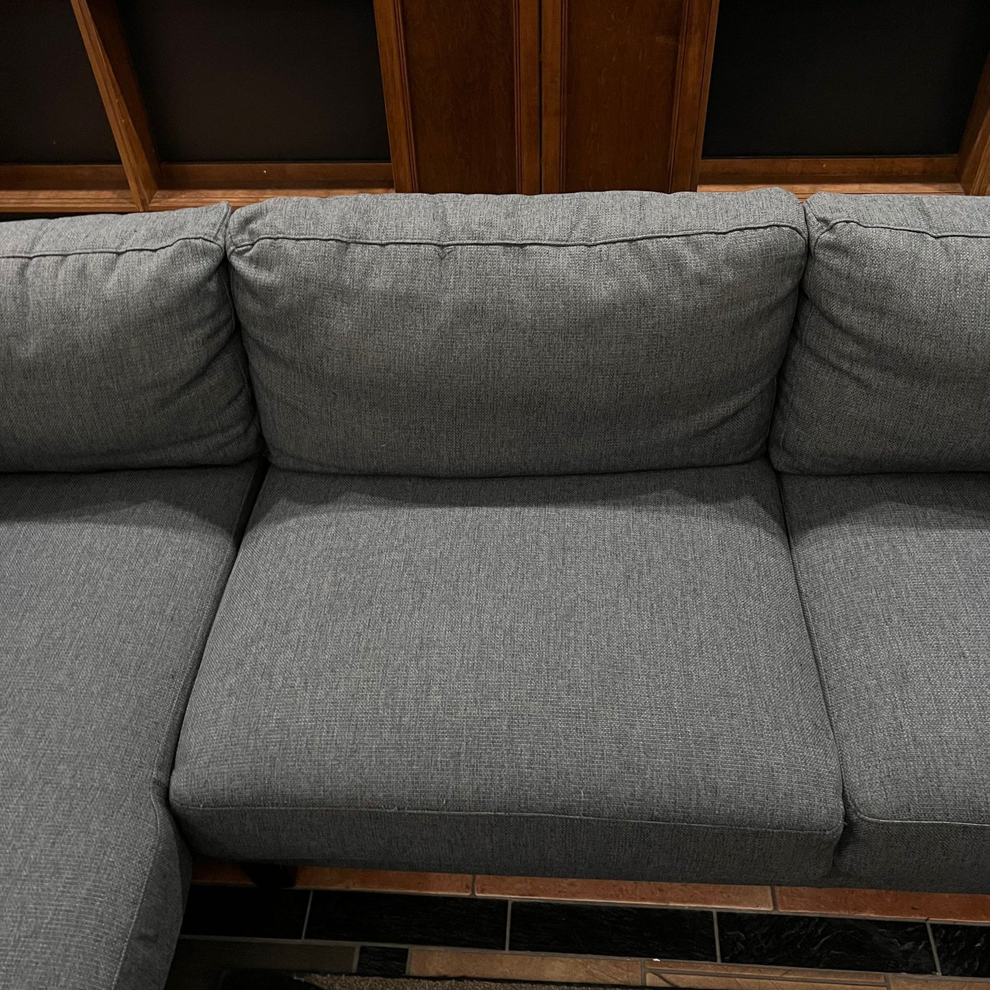 Gray modern sofa with woden legs